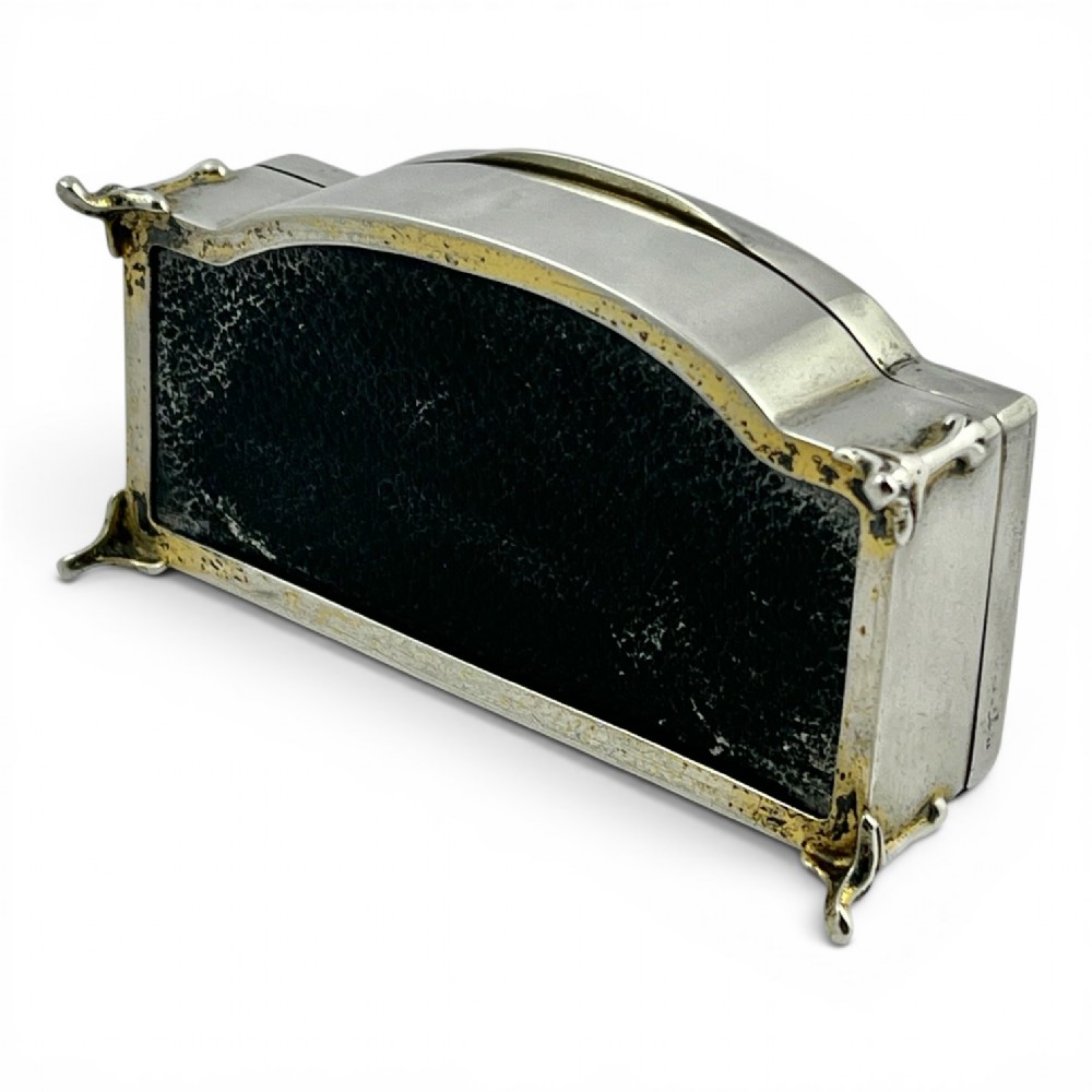 An Art Deco sterling silver jewellery box featuring a yellow guilloche enamel lid with engine-turned geometric patterns and decorative corner feet. View V