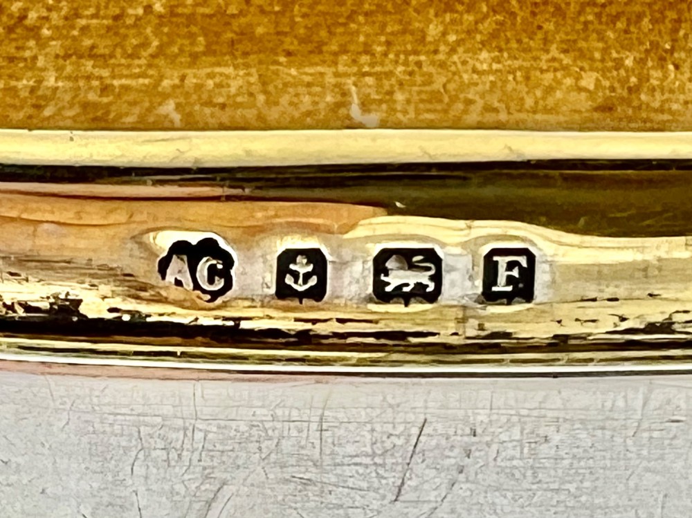 An Art Deco sterling silver jewellery box featuring a yellow guilloche enamel lid with engine-turned geometric patterns and decorative corner feet. View VII