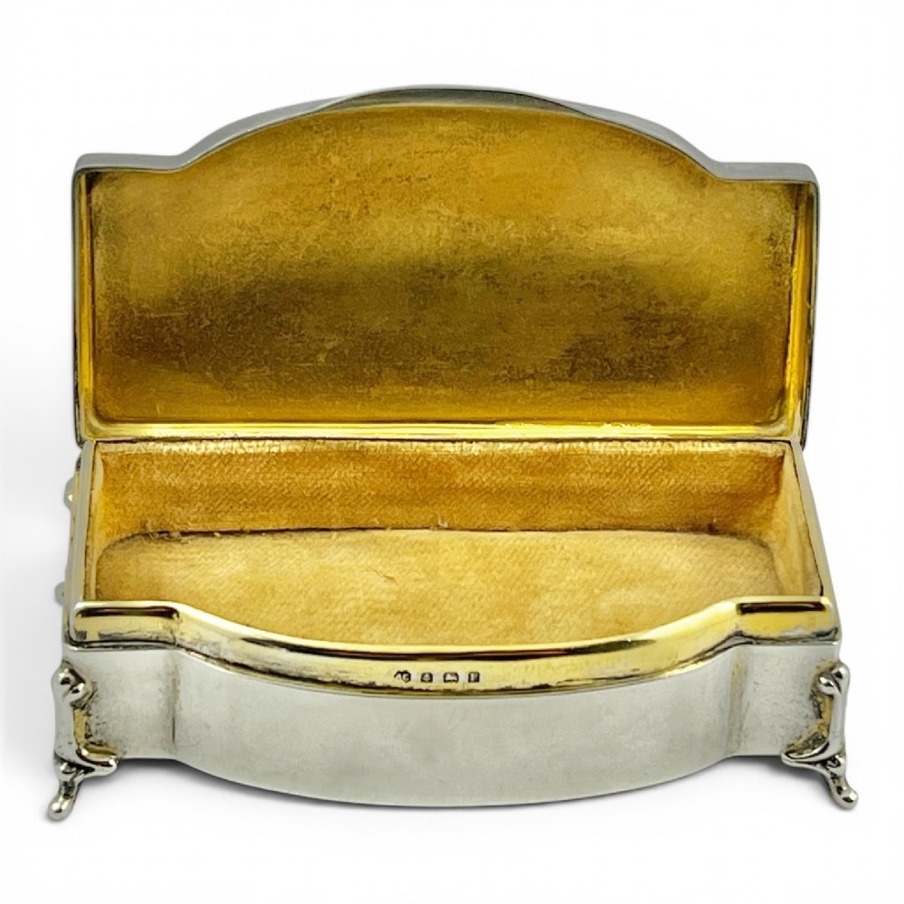 An Art Deco sterling silver jewellery box featuring a yellow guilloche enamel lid with engine-turned geometric patterns and decorative corner feet. View VIII