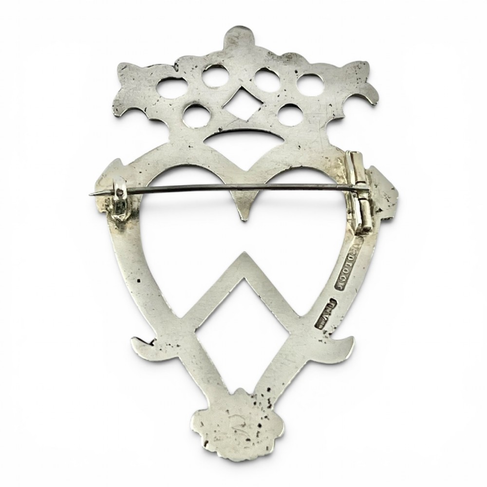An antique Scottish silver brooch featuring an engraved crowned heart motif with openwork detailing. View III