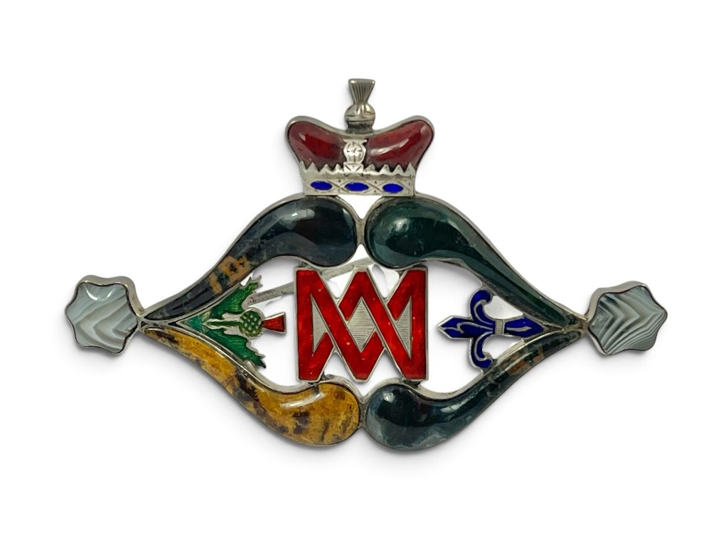 A late Victorian Scottish silver brooch inset with multi-coloured agates, red enamel monogram, blue enamel fleur-de-lis, and a crown detail. View II