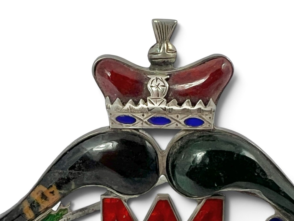 A late Victorian Scottish silver brooch inset with multi-coloured agates, red enamel monogram, blue enamel fleur-de-lis, and a crown detail. View III