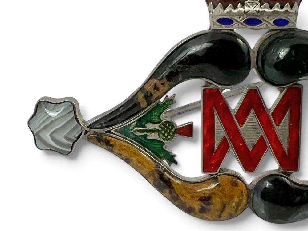 A late Victorian Scottish silver brooch inset with multi-coloured agates, red enamel monogram, blue enamel fleur-de-lis, and a crown detail. View IV