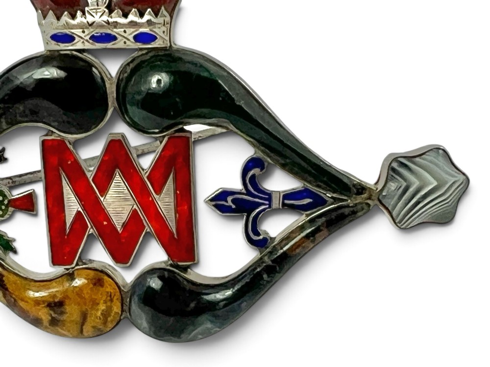 A late Victorian Scottish silver brooch inset with multi-coloured agates, red enamel monogram, blue enamel fleur-de-lis, and a crown detail. View V