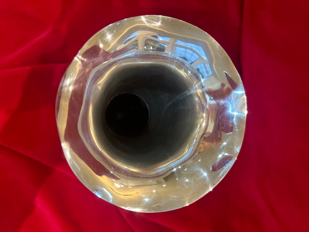 An Edwardian silver trumpet vase with a scalloped flared rim, bulbous lower stem section, and stepped circular pedestal base. View III