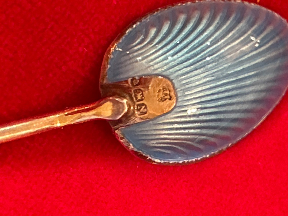 A cased set of six silver spoons featuring vibrant, colourful guilloche enamel bowls housed inside a satin-lined fitted presentation box. View III