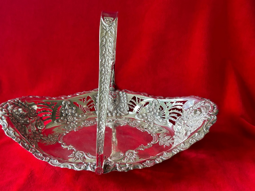 Silver oval fruit bowl with swing handle