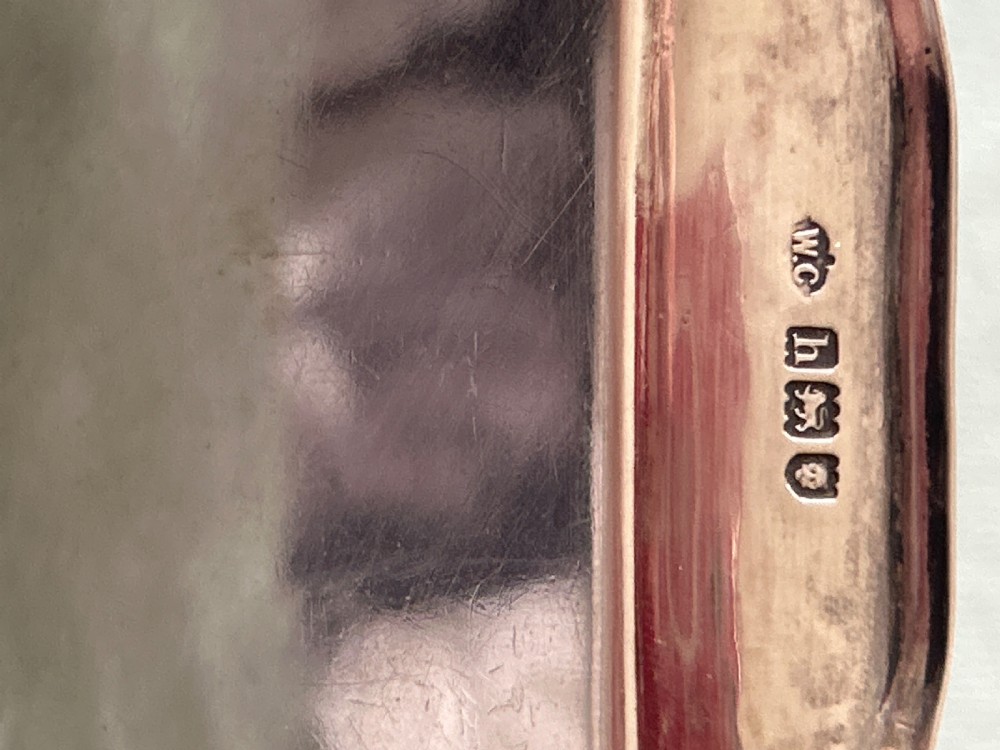 A small square silver dish featuring scalloped edges and engraved lettering dated 1948 in the centre. View III
