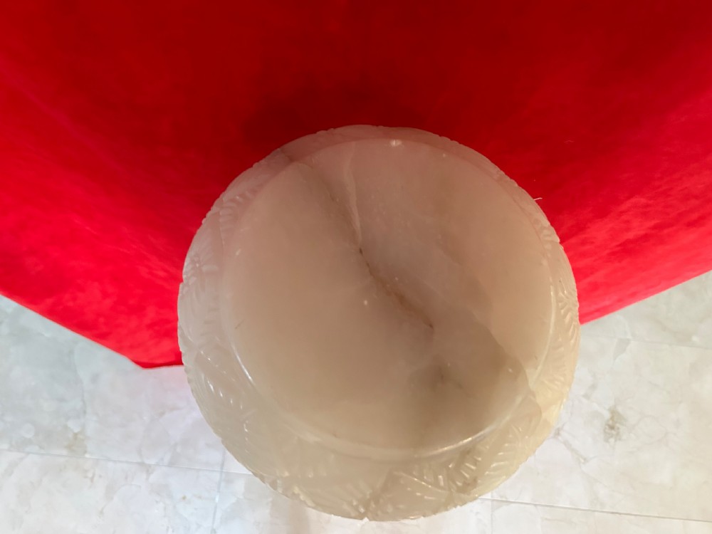 A tall carved cream alabaster plant stand featuring a round top, pierced central column, and stepped octagonal base. View III