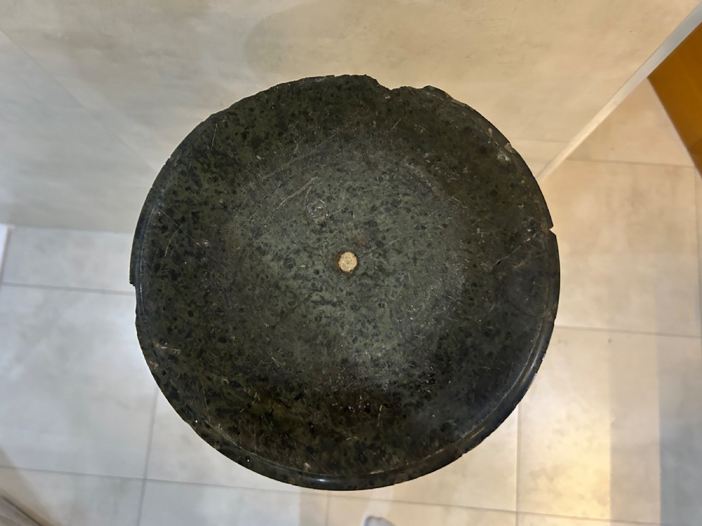 A tall dark green marble pedestal featuring a spiralled shaft, a circular top capital, and an octagonal base. View III