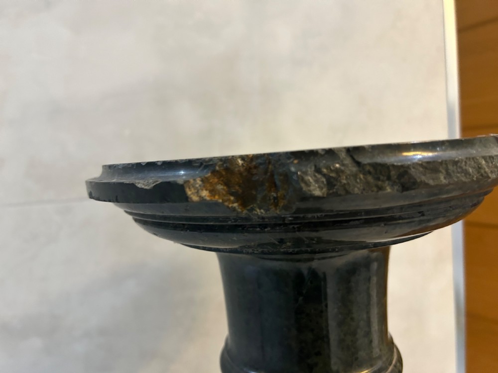 A tall dark green marble pedestal featuring a spiralled shaft, a circular top capital, and an octagonal base. View V