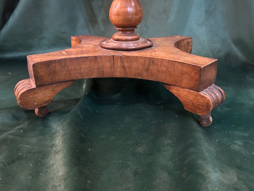 A Victorian warm brown wood games work table featuring an inlaid chessboard top, a single drawer, a damask fabric sewing well, and a turned pedestal base. View IV