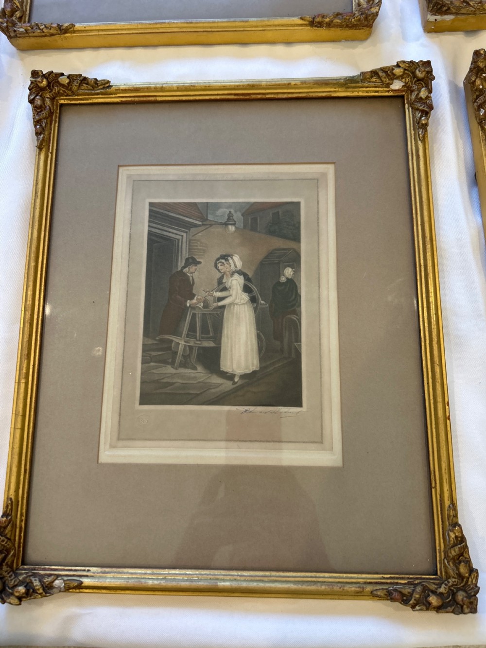 A set of seven framed antique mezzotint prints depicting classical figurative scenes, housed in ornamental gold leaf gilt frames with wide matting. View V
