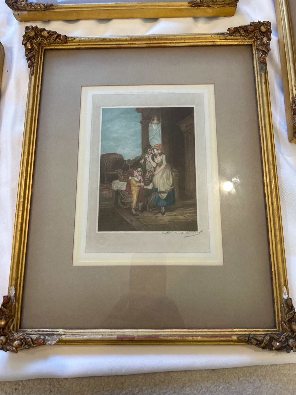 A set of seven framed antique mezzotint prints depicting classical figurative scenes, housed in ornamental gold leaf gilt frames with wide matting. View VII