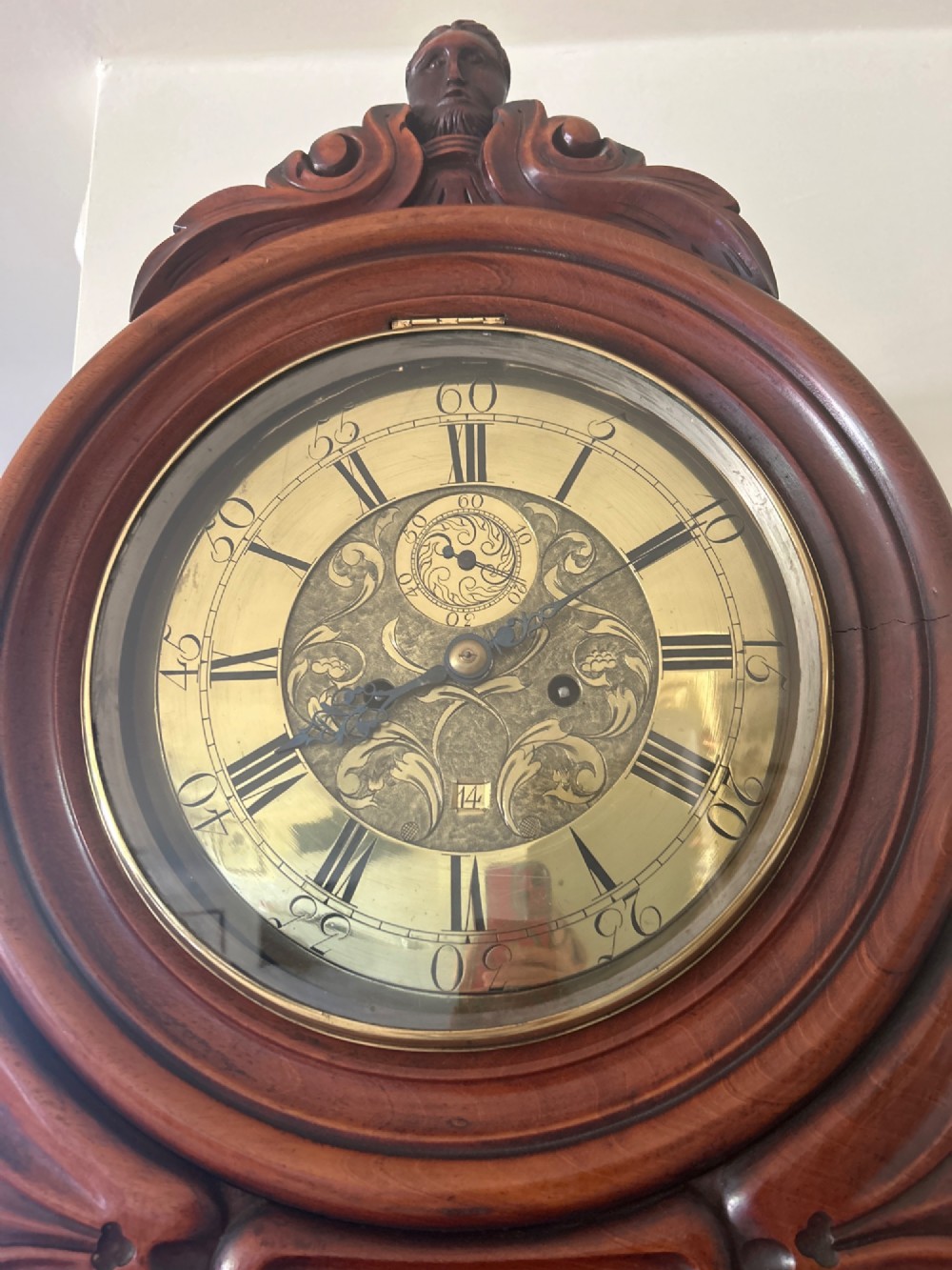 A Scottish Regency drumhead longcase clock crafted from figured mahogany wood with an engraved brass dial. View II