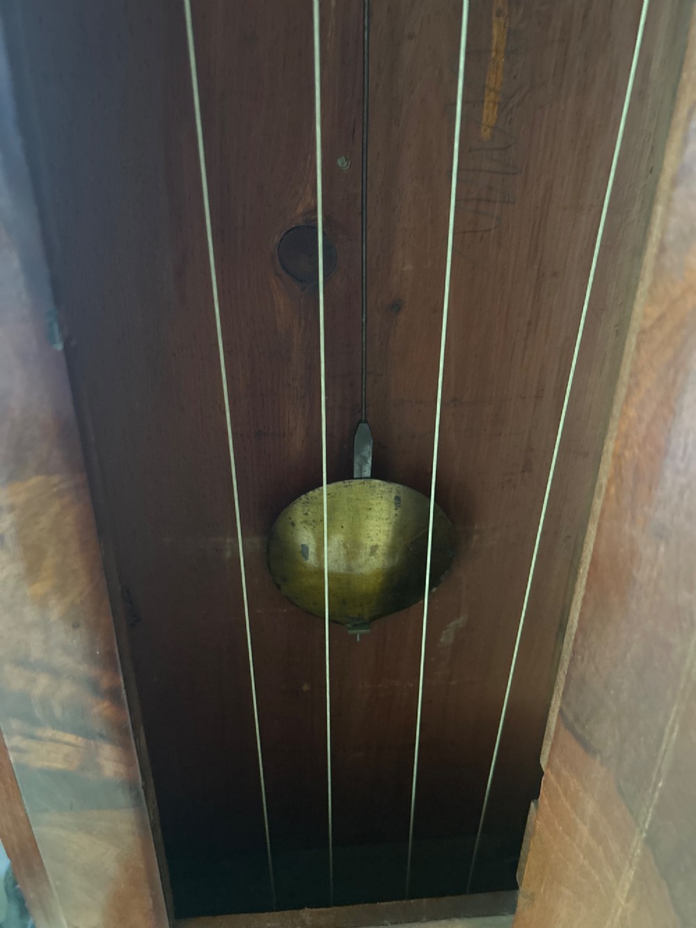 A Scottish Regency drumhead longcase clock crafted from figured mahogany wood with an engraved brass dial. View III