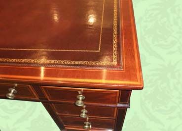 fig 1. Edwardian inlaid mahogany pedestal desk