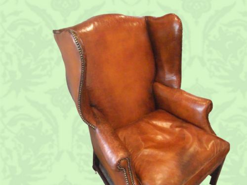 fig 1. Antique mahogany leather wing-chair