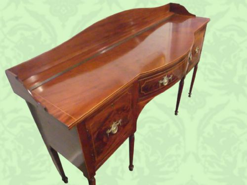 fig 2. Antique inlaid mahogany sideboard