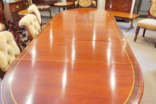 fig 1. Antique mahogany triple pillar dining table