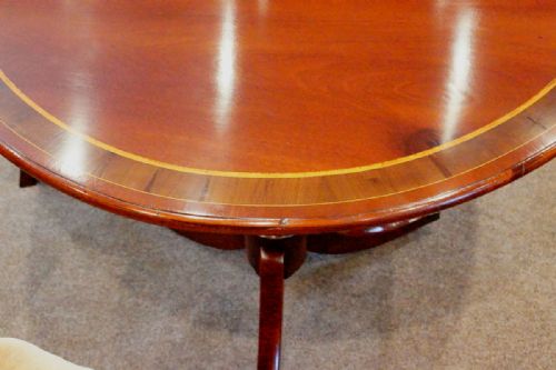 fig 2. Antique mahogany triple pillar dining table