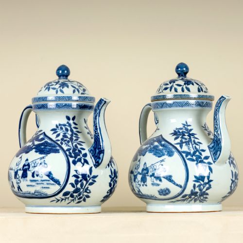 A PAIR OF 20TH CENTURY OVERSIZED TEAPOTS