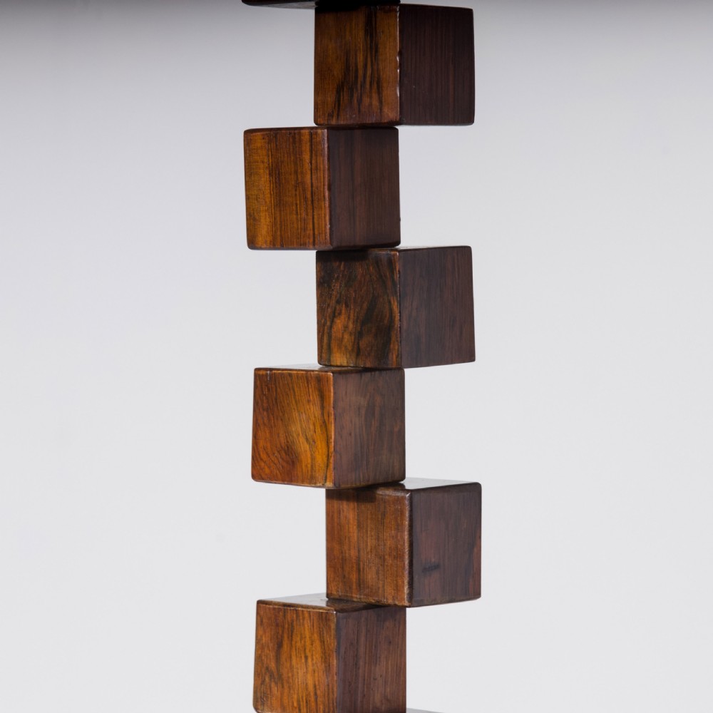 A mid-century modern wooden table lamp base constructed from offset stacked cubes terminating in a brass bulb fitting on a rectangular plinth. View III