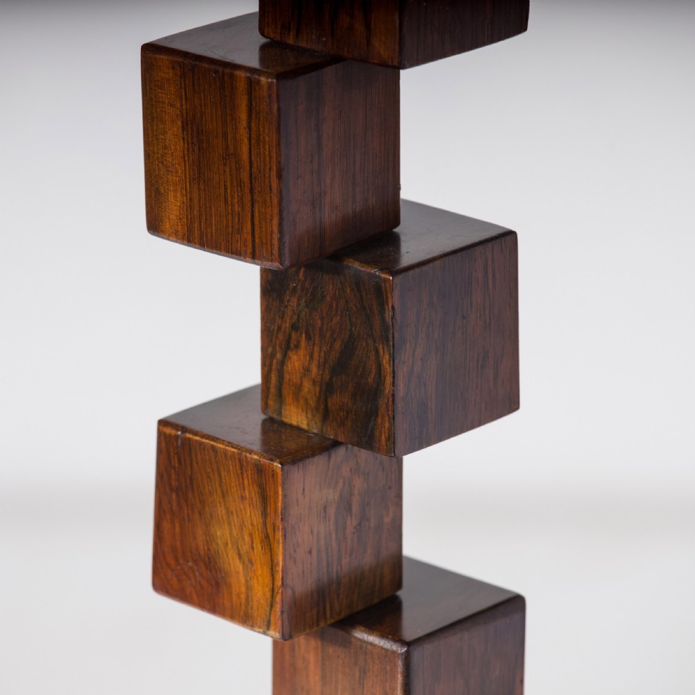 A mid-century modern wooden table lamp base constructed from offset stacked cubes terminating in a brass bulb fitting on a rectangular plinth. View IV
