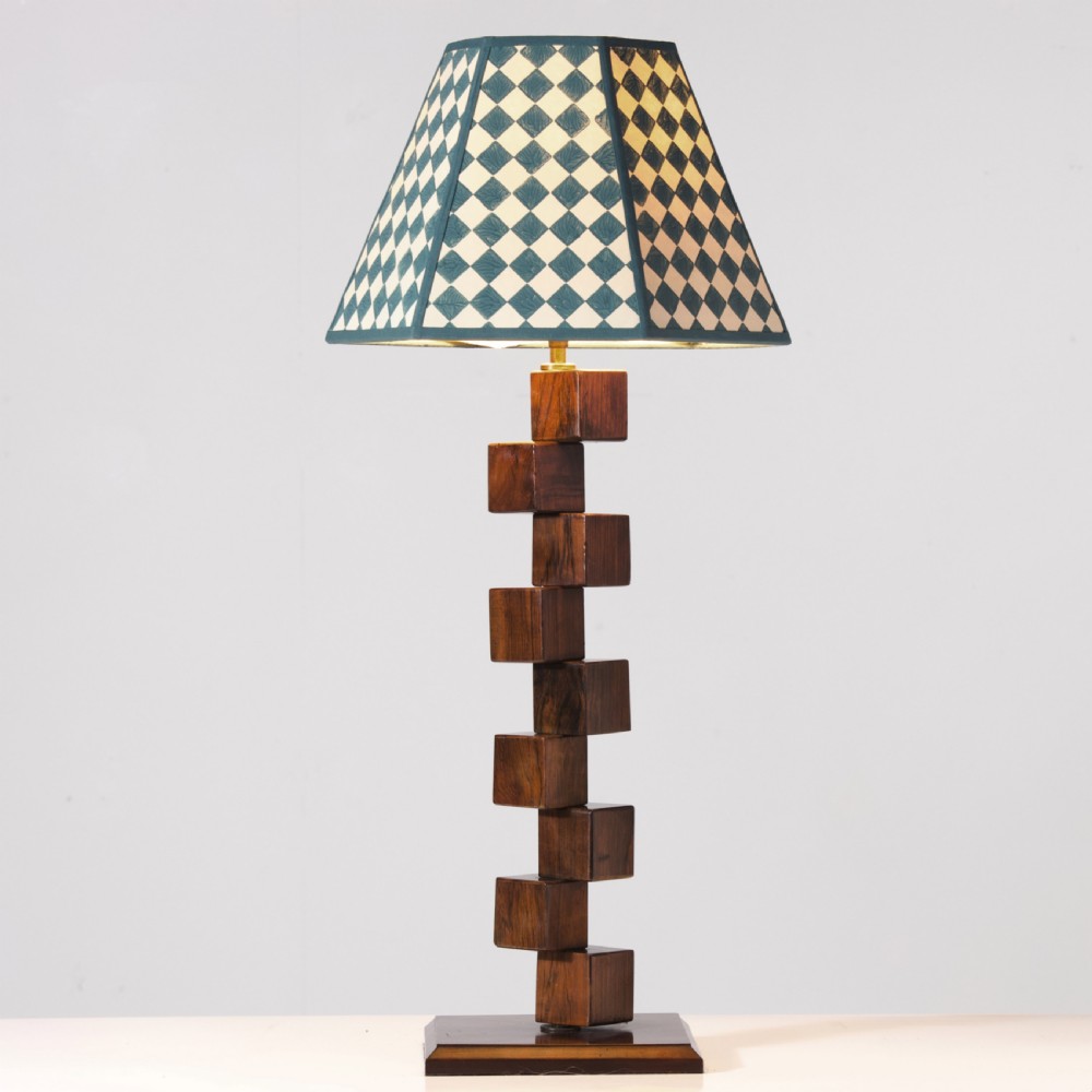 A mid-century modern wooden table lamp base constructed from offset stacked cubes terminating in a brass bulb fitting on a rectangular plinth. View VII