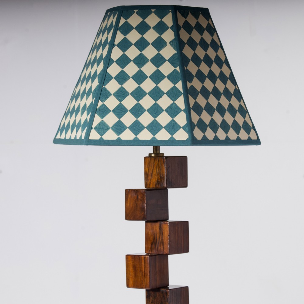 A mid-century modern wooden table lamp base constructed from offset stacked cubes terminating in a brass bulb fitting on a rectangular plinth. View VIII