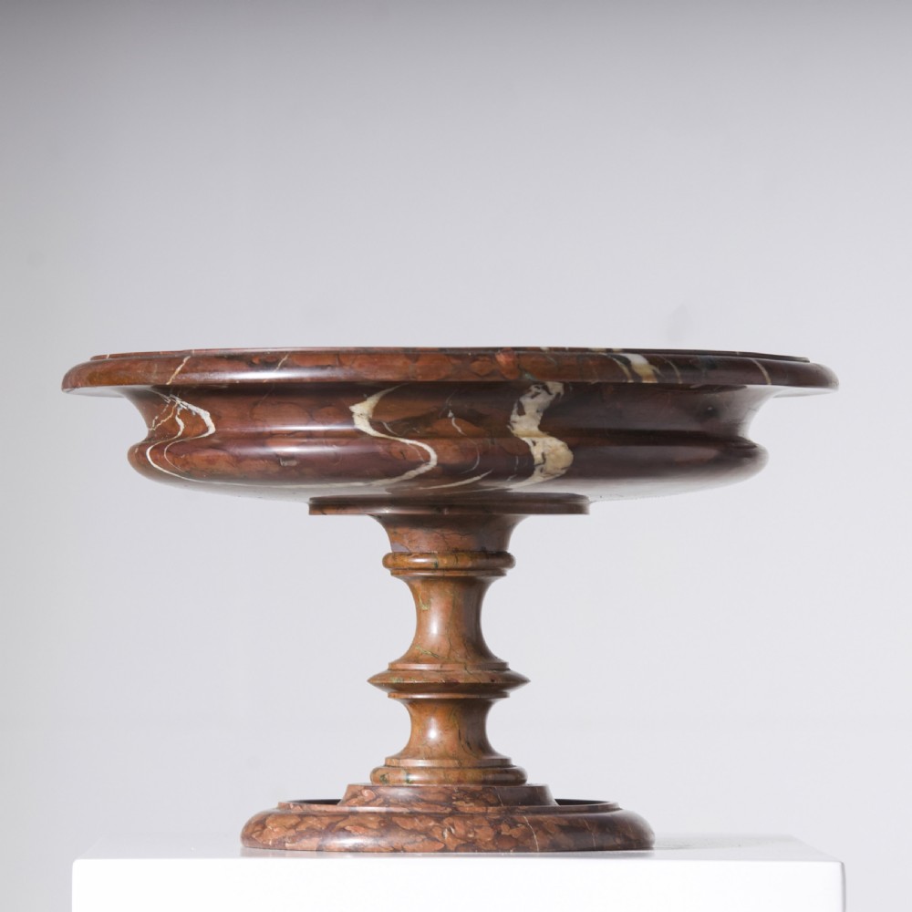 A carved reddish-brown marble tazza featuring a wide shallow dish, turned central stem, and circular moulded base. View II