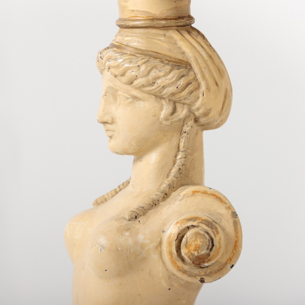 A 19th-century French Empire style circular gueridon table with a pink marble top supported by three carved cream-painted caryatid legs terminating in paw feet. View IV