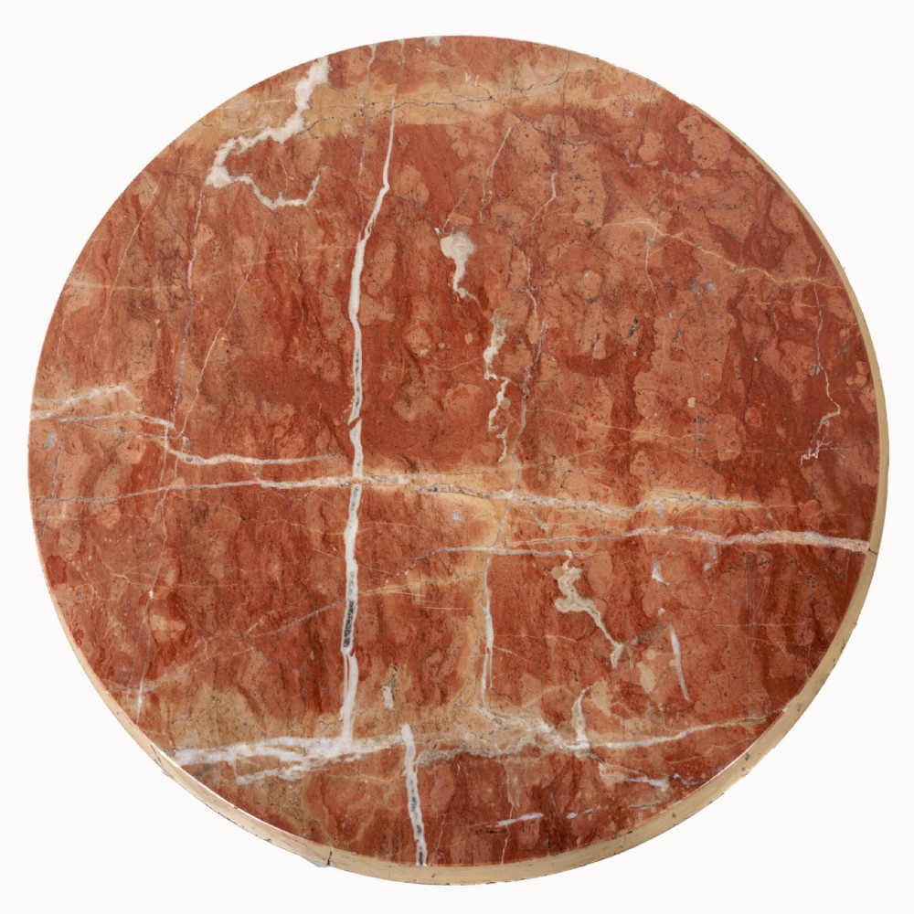 A 19th-century French Empire style circular gueridon table with a pink marble top supported by three carved cream-painted caryatid legs terminating in paw feet. View VI