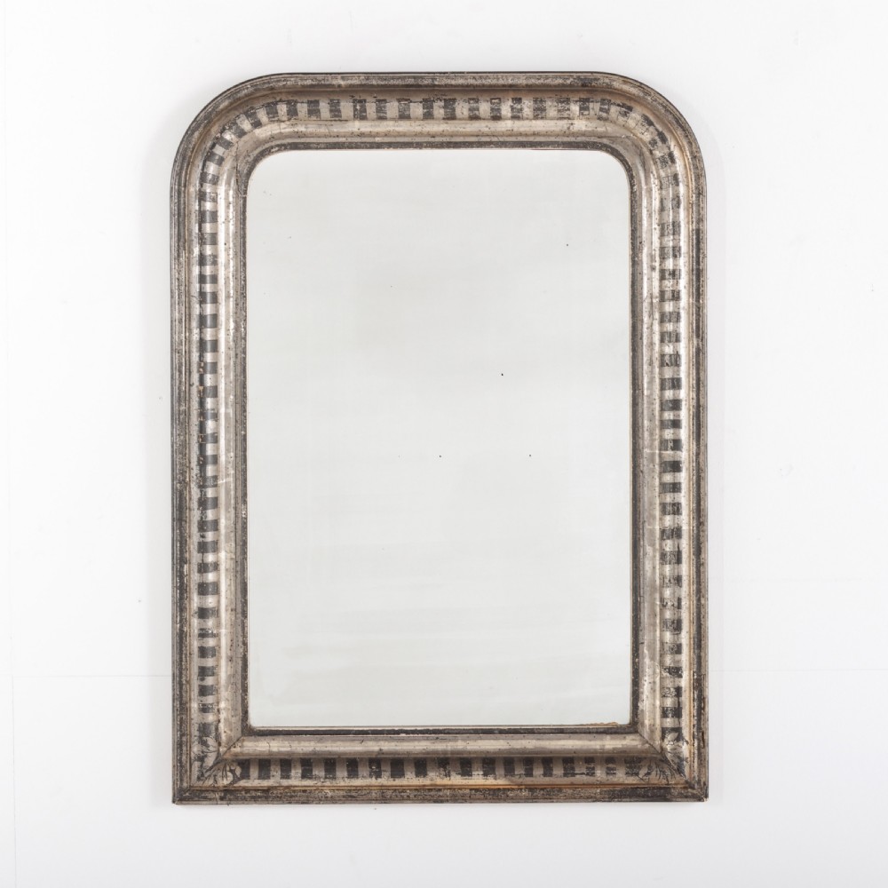 A 19th-century French Louis Philippe wall mirror featuring a silver leaf finish with a striped incised motif, rounded upper corners, and a flat base. View III
