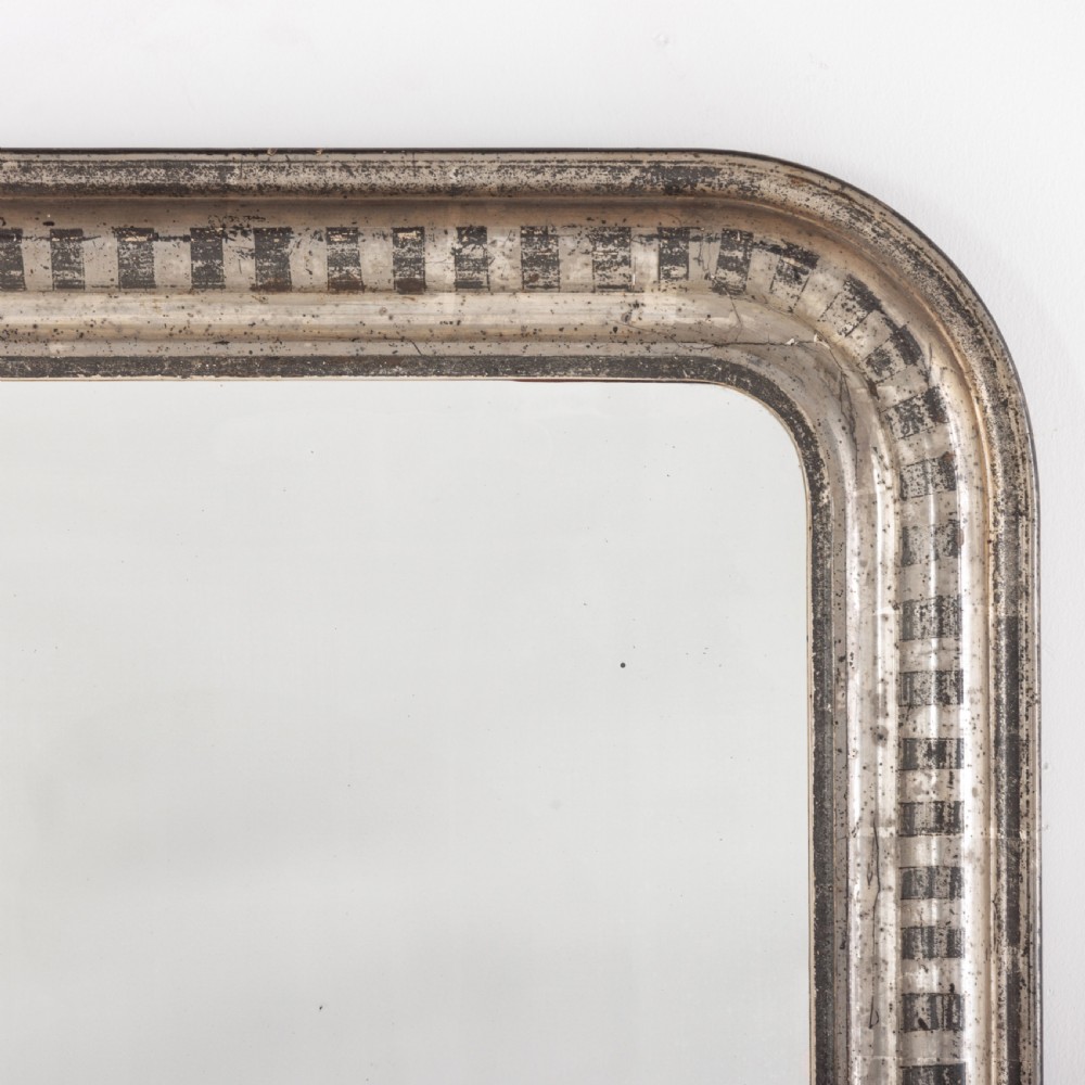 A 19th-century French Louis Philippe wall mirror featuring a silver leaf finish with a striped incised motif, rounded upper corners, and a flat base. View IV
