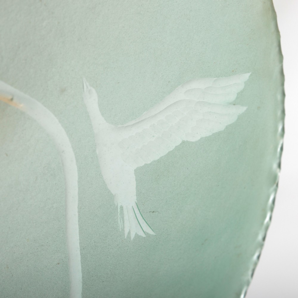 A shallow pale green frosted glass dish ceiling light featuring etched flying crane motifs and patinated metal central fittings. View III