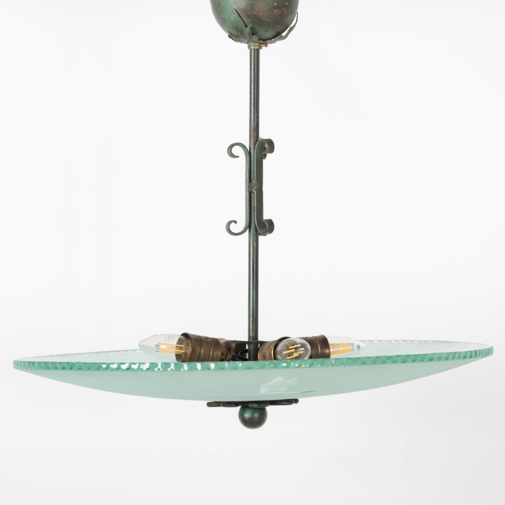 A shallow pale green frosted glass dish ceiling light featuring etched flying crane motifs and patinated metal central fittings. View XI