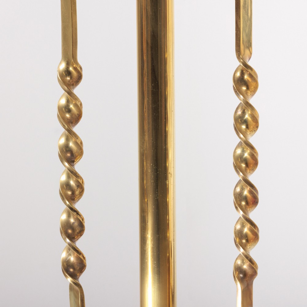 A pair of antique brass standard floor lamps featuring tripod bases, scrolled design details, and green striped pleated fabric shades. View III