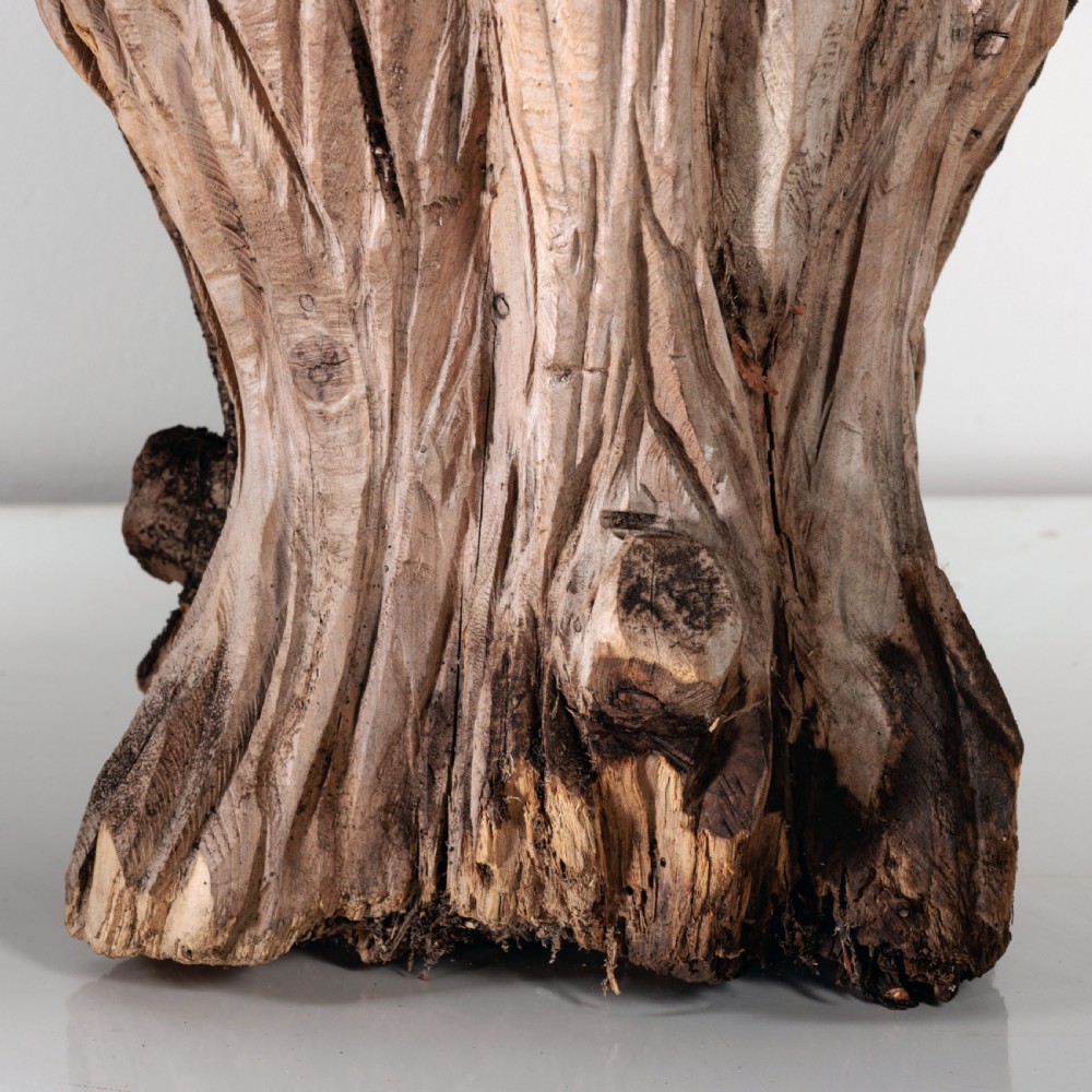 A pair of hand-carved dugout garden seats crafted from solid tree trunks with weathered timber surfaces. View VIII