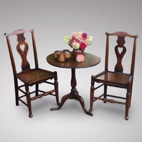 A Matched Pair of Early 19th Century Oak Side Chairs with Heart Motif