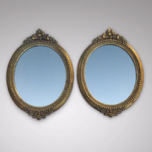 A Stunning Pair of 19th Century Oval Mirrors