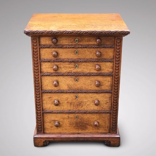 A Small Arts & Crafts Oak Chest of Drawers
