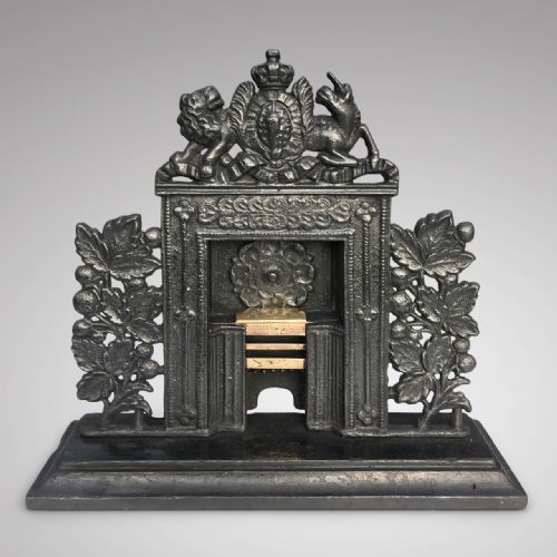 A Georgian Cast Iron & Brass Miniature Fire Surround