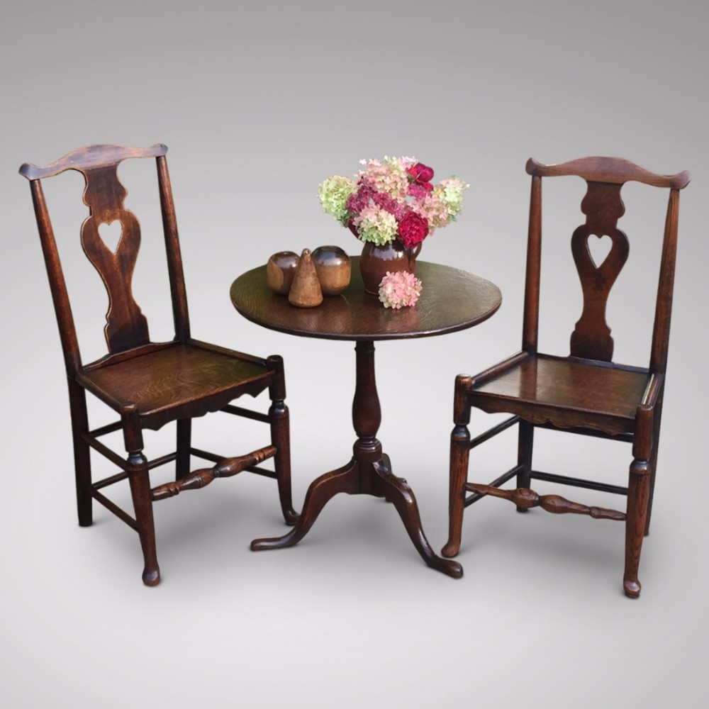 A Matched Pair of Early 19th Century Oak Side Chairs With Heart Motif