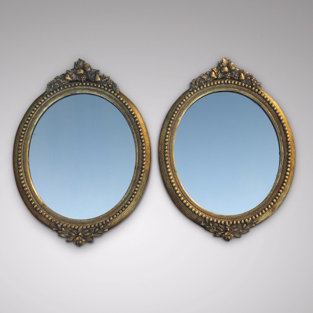 A stunning Pair of 19th Century Oval Mirrors
