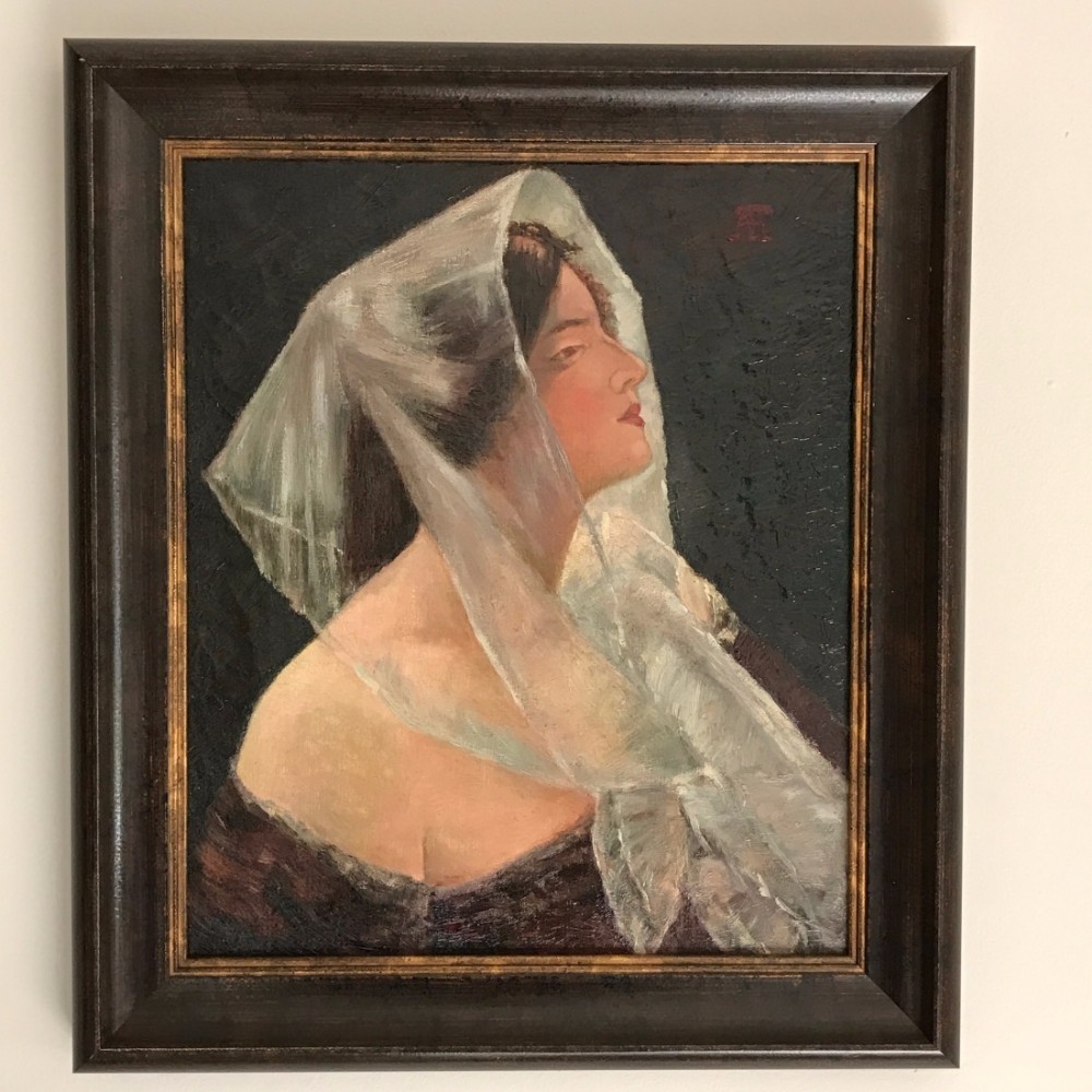 An oil painting on canvas depicting a woman in profile wearing a sheer white veil, set within a dark wooden frame.