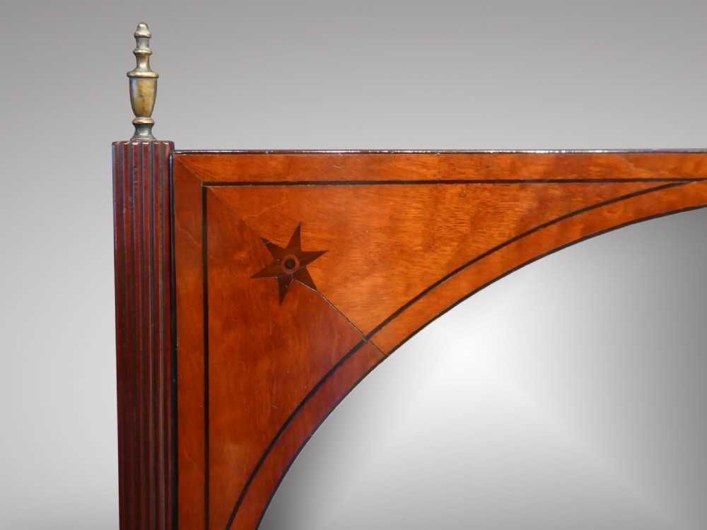 A Regency mahogany dressing table mirror featuring a circular glass plate framed in wood with star corner inlays, mounted between reeded posts above a three-drawer plinth base. View III