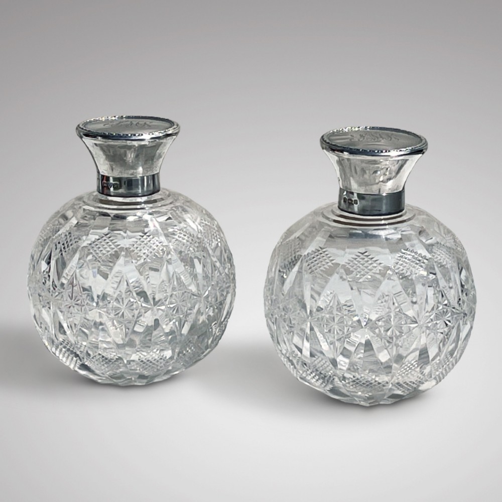 Pair of Cut Glass Perfume Bottles with Silver Hinged Lids