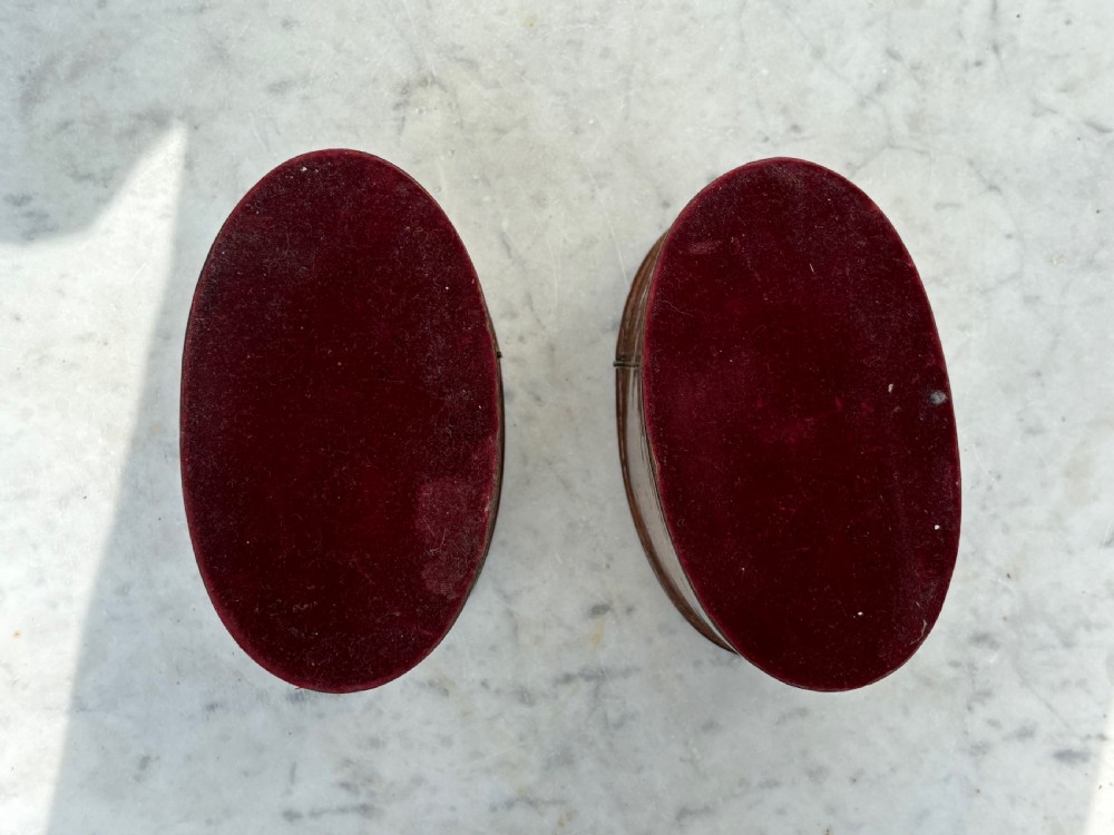 A pair of antique Georgian oval tea caddies made from burr walnut wood with flat lids. View VIII