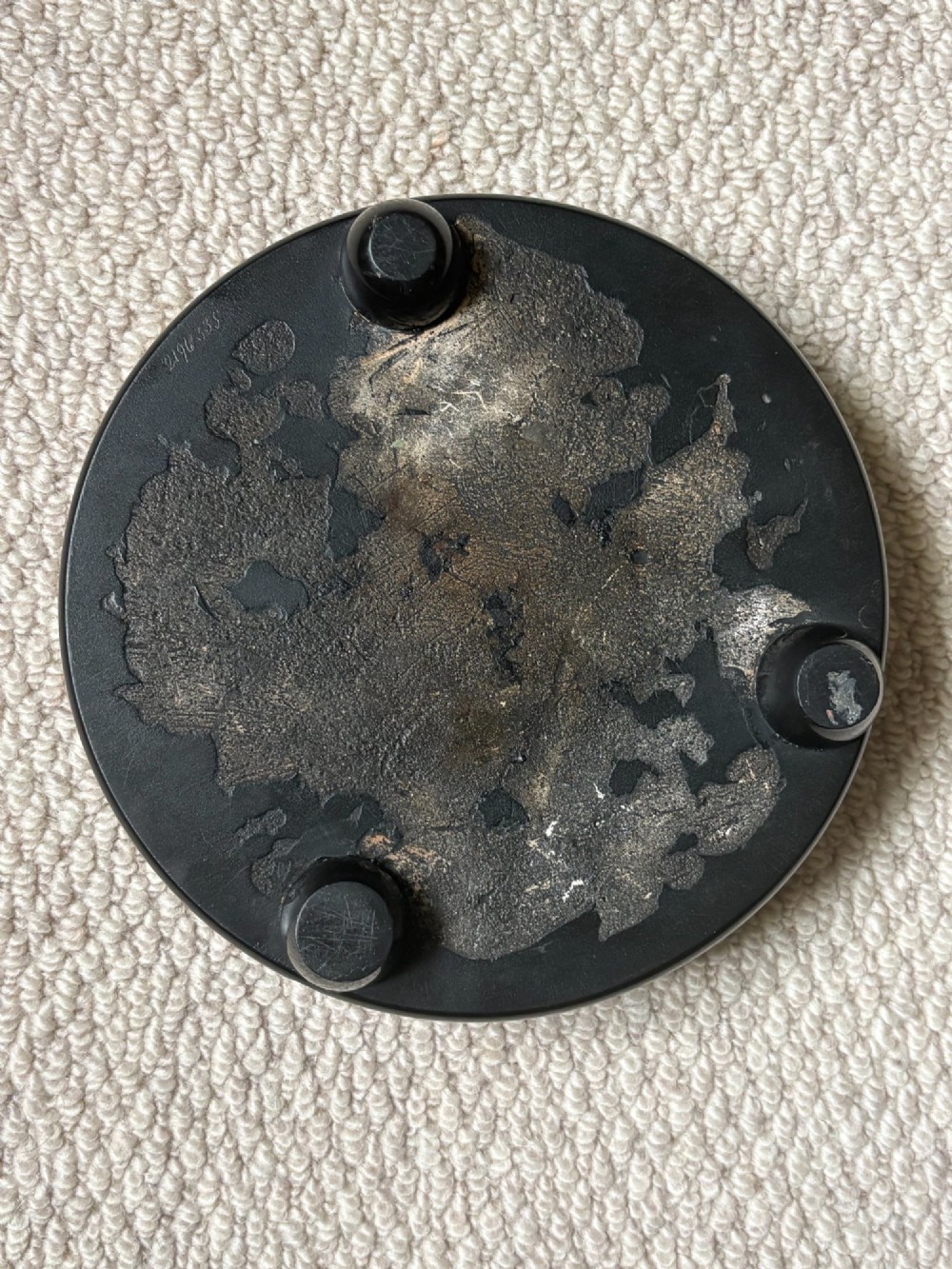 A circular black marble inkwell stand featuring detailed floral hardstone inlays and a central covered ink pot. View IV